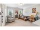 Cozy bedroom featuring neutral paint, natural light and a stylish checkered bedspread at 9595 Rod Rd, Alpharetta, GA 30022