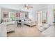 Large bedroom with two twin beds, individual desks, and a cozy lounging chair at 9595 Rod Rd, Alpharetta, GA 30022