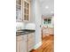 Butler pantry featuring cabinetry and countertop, leading into the kitchen at 9595 Rod Rd, Alpharetta, GA 30022