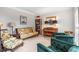 Cozy living room with a comfortable sofa, decorative chairs, and a piano creates a relaxing space at 9595 Rod Rd, Alpharetta, GA 30022