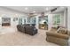 Spacious living room featuring neutral decor, plush carpeting, and recessed lighting at 9595 Rod Rd, Alpharetta, GA 30022