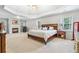 Expansive main bedroom with tray ceiling, fireplace, and plenty of natural light at 9595 Rod Rd, Alpharetta, GA 30022