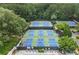 Aerial view of multiple tennis courts in a well-maintained community, offering residents recreational opportunities at 9595 Rod Rd, Alpharetta, GA 30022