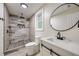 Renovated bathroom with a glass-enclosed shower and modern fixtures at 1268 Ladd Sw St, Atlanta, GA 30310