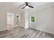 Comfortable bedroom features wood-look flooring, a ceiling fan, and a closet at 1268 Ladd Sw St, Atlanta, GA 30310