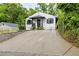Inviting home with a long driveway, a quaint front porch, and a neatly kept lawn at 1268 Ladd Sw St, Atlanta, GA 30310