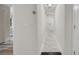 Bright hallway featuring a clean white finish, modern lighting, and a view to other rooms at 1268 Ladd Sw St, Atlanta, GA 30310