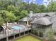 Aerial view of the rear of the home with a pool and large deck at 1678 Rabke Rd, Canton, GA 30114