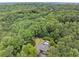 Expansive aerial view of home nestled among lush mature trees at 1678 Rabke Rd, Canton, GA 30114