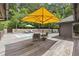 Backyard pool area with mature trees and comfortable outdoor furniture at 1678 Rabke Rd, Canton, GA 30114