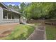Home has a secluded backyard and a wooden deck with a pool at 1678 Rabke Rd, Canton, GA 30114