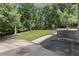 Exterior angle featuring manicured lawn, and lush greenery and mature landscaping at 1678 Rabke Rd, Canton, GA 30114