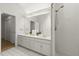 Clean bathroom features double vanity and a glass shower enclosure at 1678 Rabke Rd, Canton, GA 30114