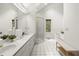 Bright bathroom features double vanity, a tub, and glass shower enclosure at 1678 Rabke Rd, Canton, GA 30114