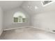 Spacious bedroom with vaulted ceiling, skylight, and large window with wooded view at 1678 Rabke Rd, Canton, GA 30114