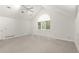 Spacious bedroom featuring neutral tones, vaulted ceilings, large window and plush carpet at 1678 Rabke Rd, Canton, GA 30114