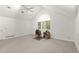 Large bedroom features neutral walls, fan, vaulted ceilings, and window with wooded views at 1678 Rabke Rd, Canton, GA 30114