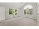 Spacious bedroom features vaulted ceiling, large windows, and neutral carpeting at 1678 Rabke Rd, Canton, GA 30114