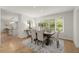 Elegant dining room featuring wood floors, a large window, and an open layout at 1678 Rabke Rd, Canton, GA 30114