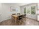Cozy dining room with a large window and comfortable seating for four at 1678 Rabke Rd, Canton, GA 30114