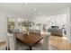 Bright dining room connects to the living area, with a large dining table and natural light at 1678 Rabke Rd, Canton, GA 30114