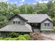 Attractive exterior elevation with skylights and beautiful green surroundings at 1678 Rabke Rd, Canton, GA 30114