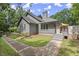 Exterior of home with walkway leading to deck and pool area at 1678 Rabke Rd, Canton, GA 30114