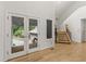 Open foyer with a staircase and glass doors to a front porch, filled with natural light at 1678 Rabke Rd, Canton, GA 30114