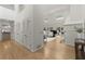 Open hallway leading to a living room, featuring skylights and ample closet space at 1678 Rabke Rd, Canton, GA 30114