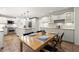 Open kitchen features large island, stainless appliances, and natural light at 1678 Rabke Rd, Canton, GA 30114