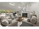 Bright living room with a fireplace, skylights, and sliding doors to the outdoor deck at 1678 Rabke Rd, Canton, GA 30114