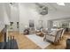 Spacious living room featuring a fireplace, large windows, and comfortable seating areas at 1678 Rabke Rd, Canton, GA 30114
