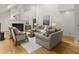 Cozy living room with a fireplace, high ceilings, and comfortable seating arrangement at 1678 Rabke Rd, Canton, GA 30114