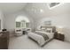 Bright main bedroom features a vaulted ceiling, sitting area, and large windows at 1678 Rabke Rd, Canton, GA 30114