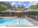 Back of house features a pool and wooden deck with seating arrangements at 1678 Rabke Rd, Canton, GA 30114