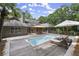 Backyard pool and wooden deck surrounded by lush landscaping at 1678 Rabke Rd, Canton, GA 30114
