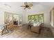 Cozy sunroom featuring tile flooring, multiple windows, and access to other rooms at 1678 Rabke Rd, Canton, GA 30114