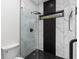 Luxurious bathroom featuring a glass-enclosed shower with unique black and marble tiling at 178 Wesley Ne Ave # B, Atlanta, GA 30307