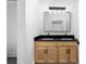 Modern bathroom featuring double vanity, black countertop, and modern lighting at 178 Wesley Ne Ave # B, Atlanta, GA 30307