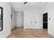 Spacious bedroom with hardwood flooring, a ceiling fan, and two built-in bookshelves at 178 Wesley Ne Ave # B, Atlanta, GA 30307