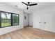 Bright bedroom with hardwood floors, a modern ceiling fan, large windows and lots of natural light at 178 Wesley Ne Ave # B, Atlanta, GA 30307
