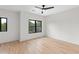 Bright, airy bedroom with hardwood floors, two large windows, and modern ceiling fan at 178 Wesley Ne Ave # B, Atlanta, GA 30307