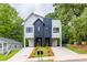 Modern duplex with striking black and white exterior, double driveways, and manicured landscaping at 178 Wesley Ne Ave # B, Atlanta, GA 30307