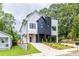 Striking modern home with contrasting black and white exterior, beautiful landscaping, and a welcoming driveway at 178 Wesley Ne Ave # B, Atlanta, GA 30307