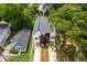Aerial view of a two-story home with nice rooflines, a modern facade, and beautiful trees in a residential area at 178 Wesley Ne Ave # B, Atlanta, GA 30307