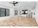 Bright, open kitchen with modern appliances and a stylish backsplash, complemented by light hardwood floors and contemporary design at 178 Wesley Ne Ave # B, Atlanta, GA 30307