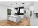 Modern kitchen with white cabinets, marble countertops, black backsplash and stainless steel appliances at 178 Wesley Ne Ave # B, Atlanta, GA 30307