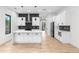 Contemporary kitchen featuring white cabinets, stainless steel appliances, and a large marble countertop island at 178 Wesley Ne Ave # B, Atlanta, GA 30307