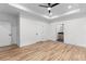 Spacious main bedroom with tray ceiling, fan, and en-suite bathroom at 178 Wesley Ne Ave # B, Atlanta, GA 30307