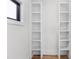 Built-in shelving units next to a window on hardwood floors in a well-lit room at 178 Wesley Ne Ave # B, Atlanta, GA 30307